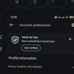 Close-up of a smartphone screen displaying account verification alert. Ideal for security and authenticity themes.