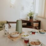 Inviting morning breakfast scene with oatmeal, tea, and elegant decor, perfect for a cozy start.